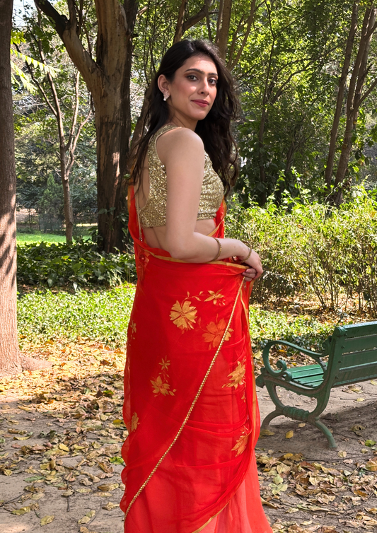 Malook orange Chiffon saree with Hand-Painted Golden floral motifs 