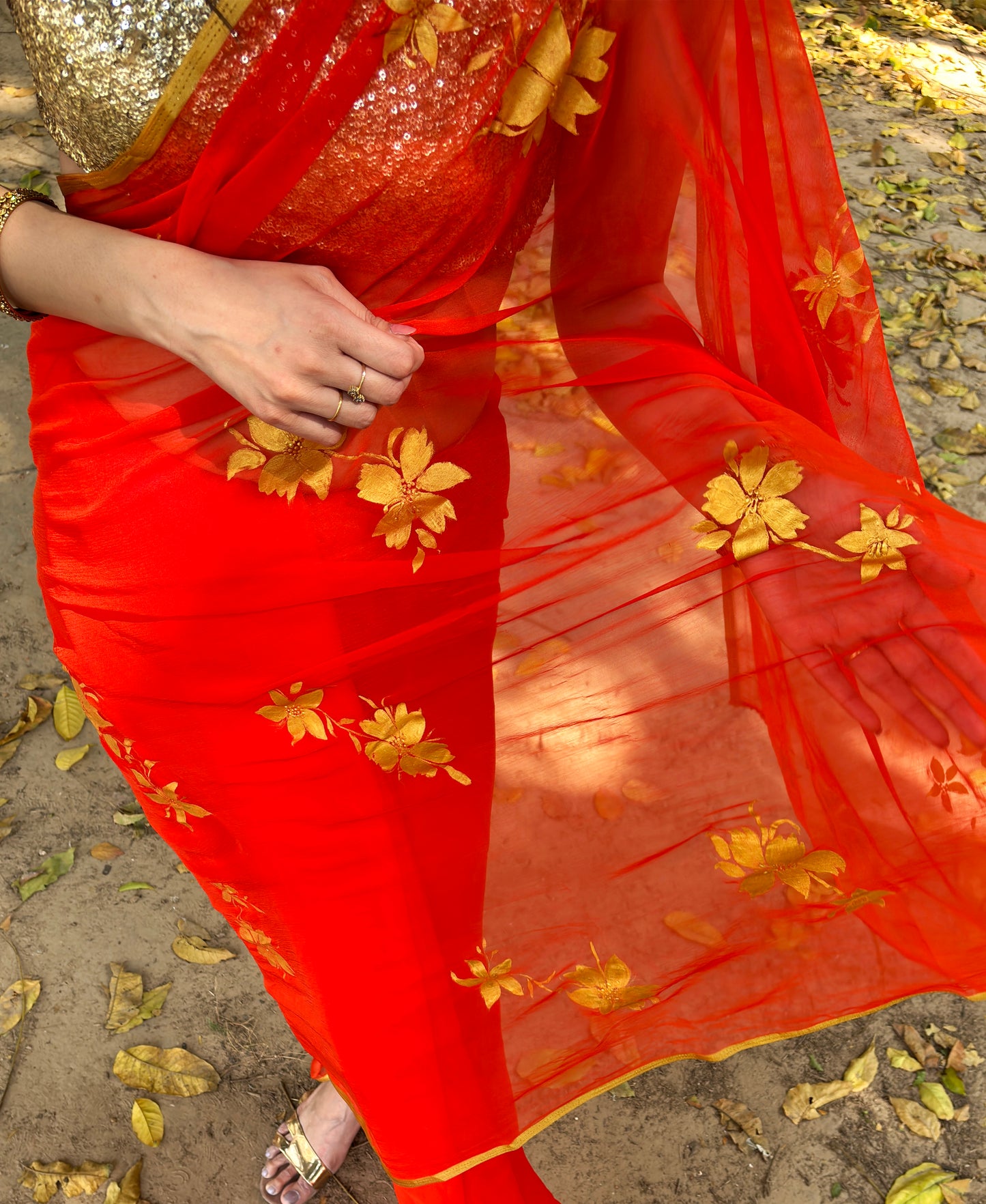 Malook orange Chiffon saree with Hand-Painted Golden floral motifs 