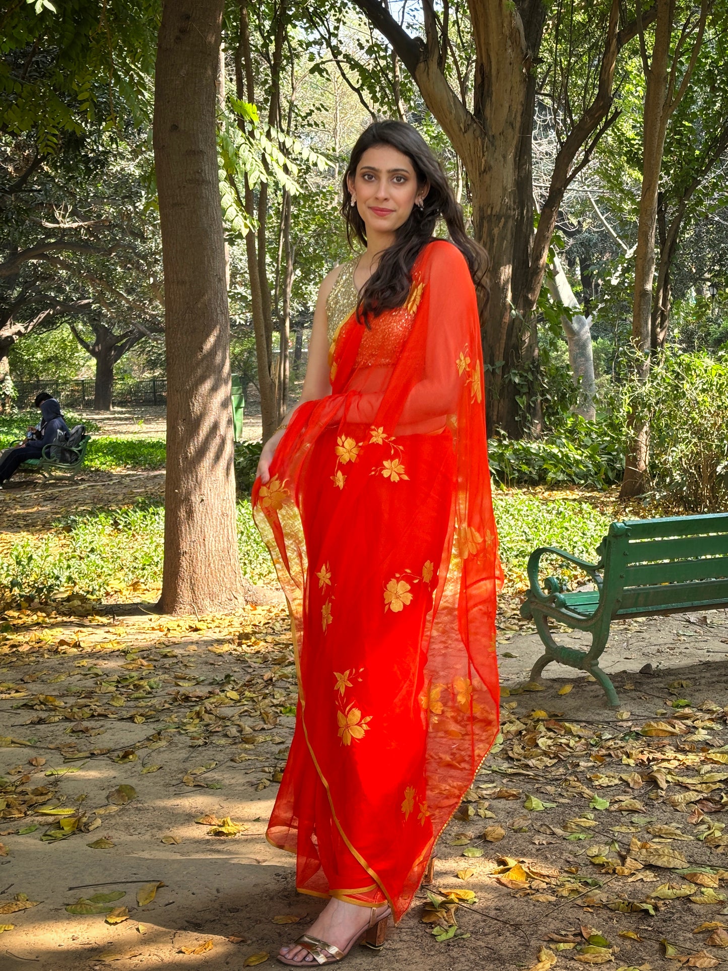 Malook orange Chiffon saree with Hand-Painted Golden floral motifs 