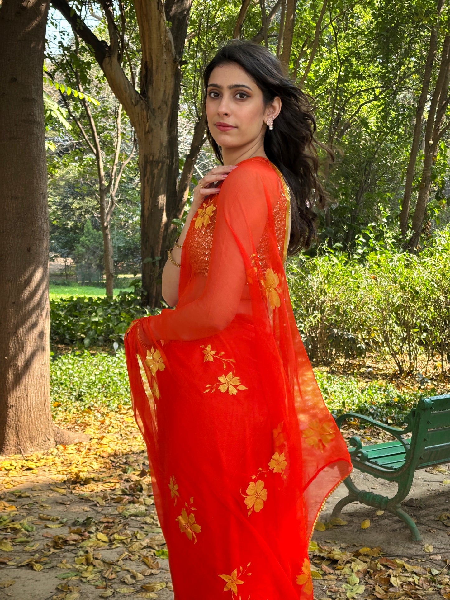 Malook orange Chiffon saree with Hand-Painted Golden floral motifs 